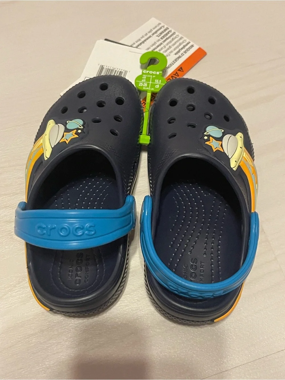 CROCS Kids Navy Light Up Clogs with Blue Straps and Orange-Yellow Space Accents